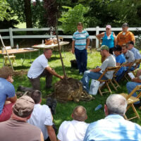 Lindsey Purcell sharing tree planting tips at outside workshop. Purdue Landscape Report receives TEAM award.