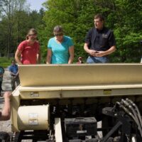 Jarred Brooke teaching at outside workshop regarding planting native grasslands for wildlife and pollinators.