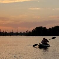 Image of paddler in lake