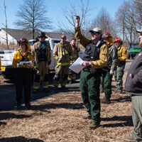 Jarred Brooke instructs his class before a prescribed burn in spring 2026 at the Celery Bog.
